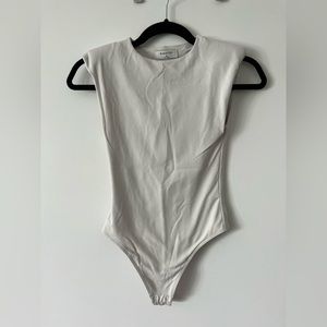 Babaton (Aritzia) Contour Shoulder Pad Snap Bodysuit. Size XS, NWOT